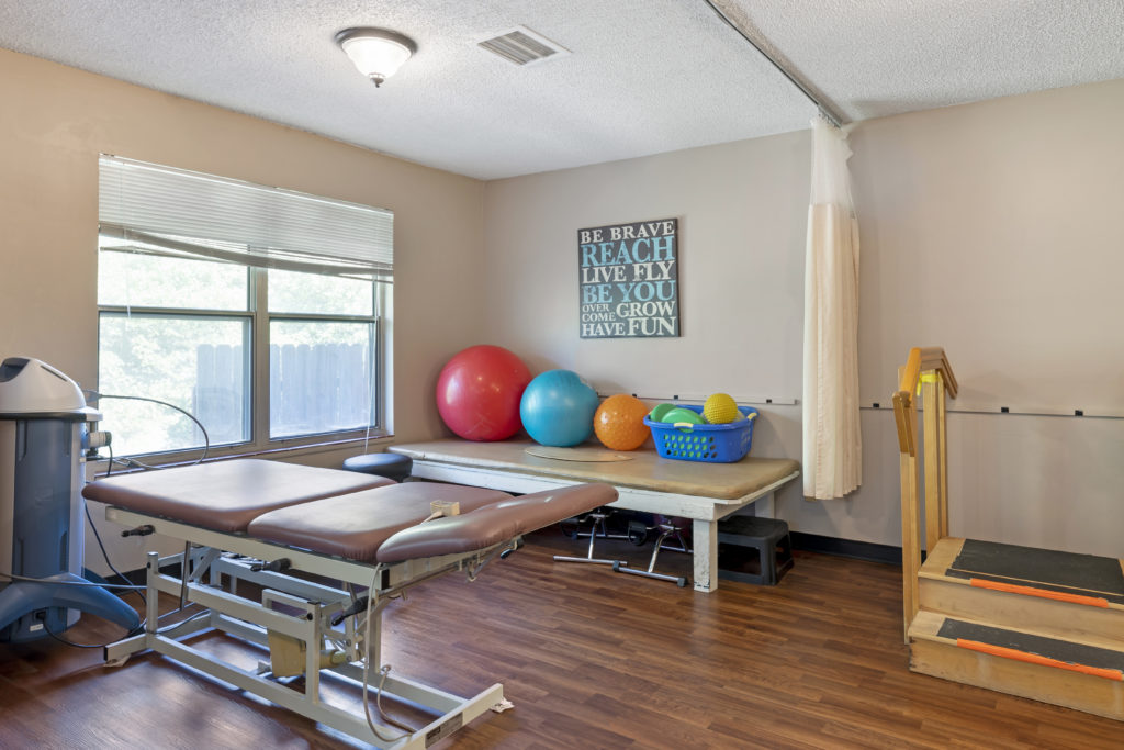 Therapy gym with exercise equipment